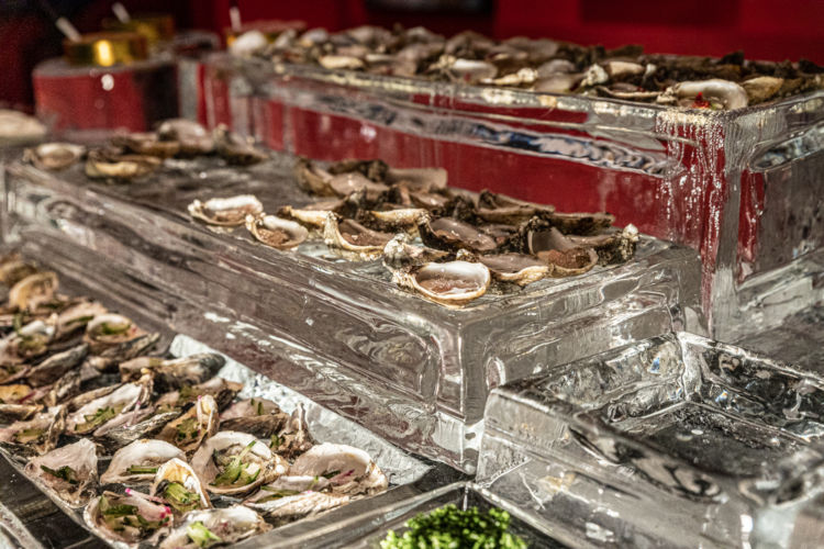 Oysters served on ice trays for the Savore Hermes Event.