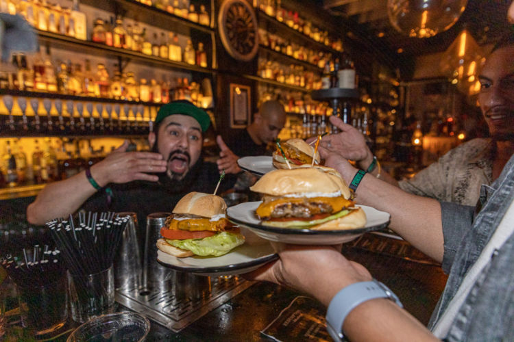 Burgers being served at the Redemption Whiskey at Bartender’s Weekend