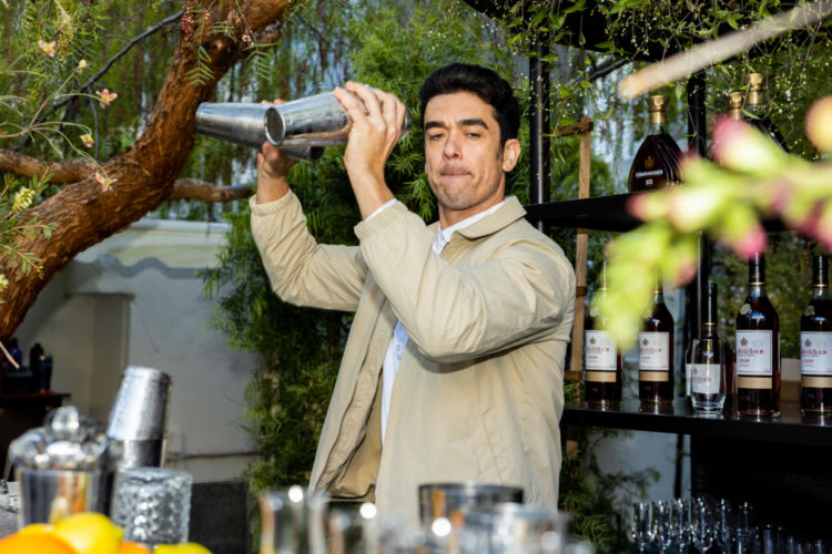 A man preparing drinks.