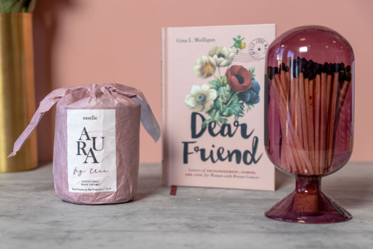 A Dear Friend book photographed with a wrapped candle and matches.