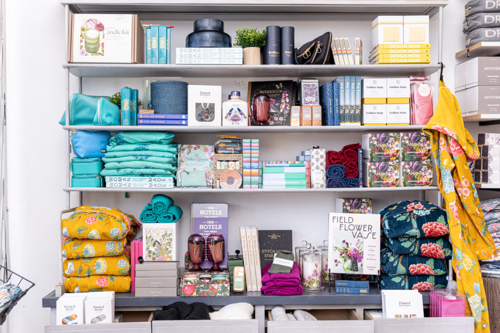 Various products with different colors on shelves.