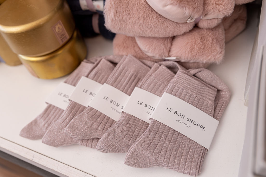 Lilac colored socks stacked together on a clean surface.